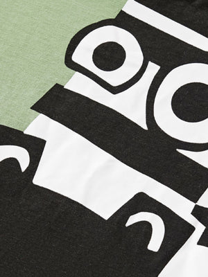 Green cotton toddler tee with playful black and white cartoon zebra print detail.