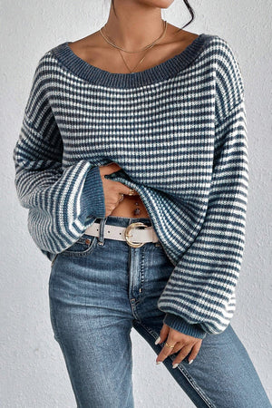 Blue striped off-shoulder knit pullover sweater with wide sleeves.