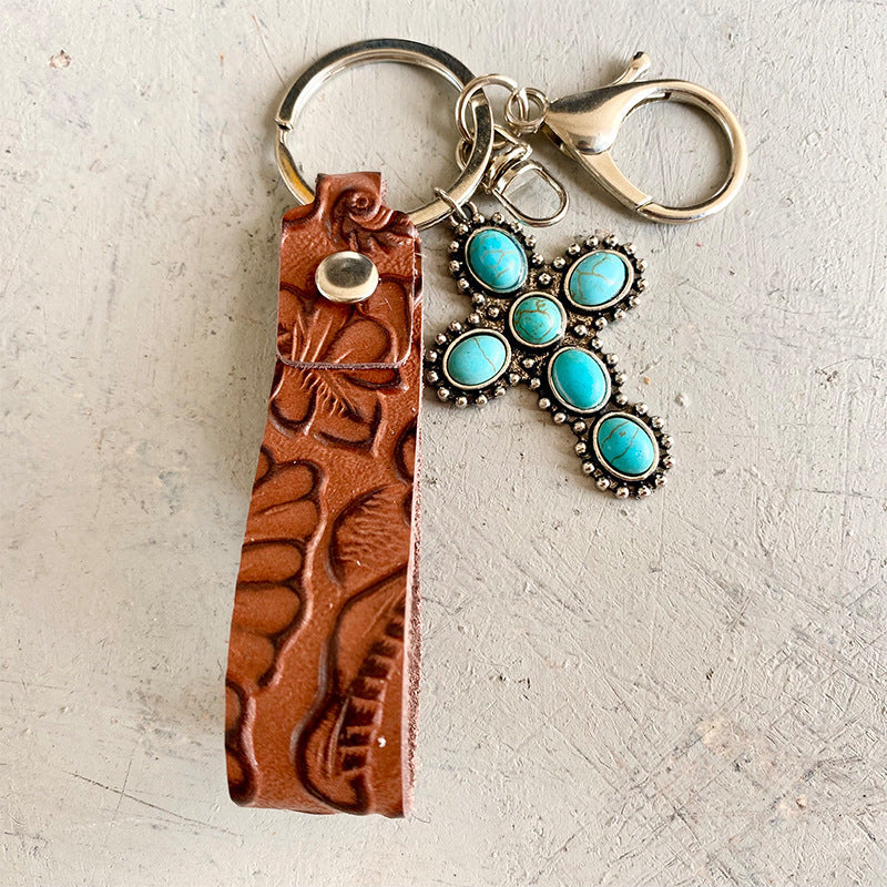 Tooled leather keyring with turquoise cross charm and silver hardware