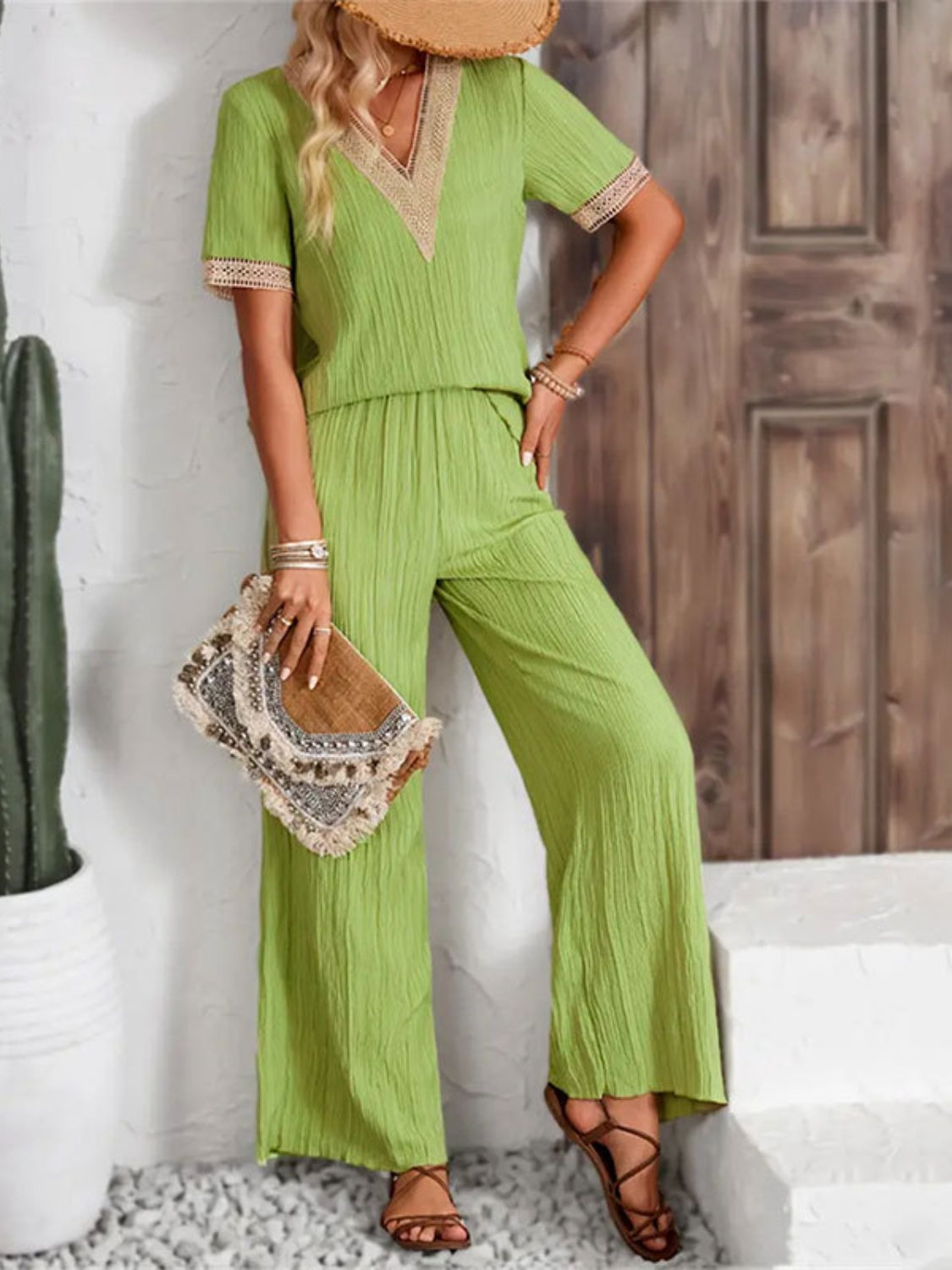 Lime crinkle knit v-neck co-ord set with embroidered trim and wide leg pants.