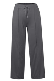 Seamed palazzo lounge trousers in dark gray with drawstring waist and wide legs.