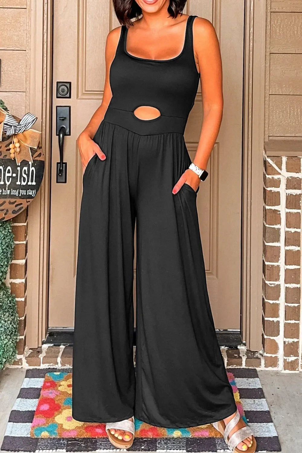 Black wide-leg jumpsuit with scoop neck and keyhole cutout detail.