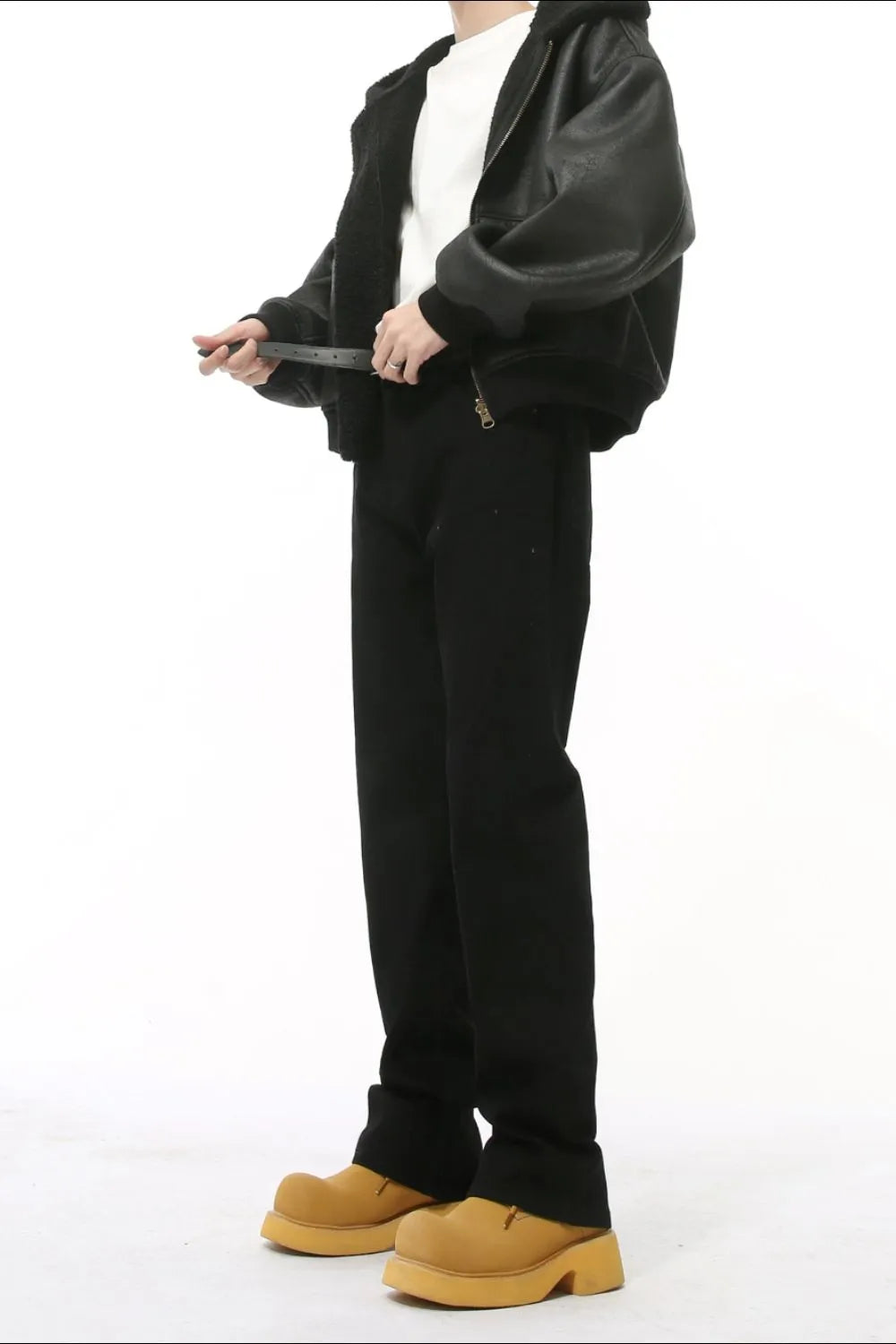 Black mid-rise flared leg tailored trousers with a zipper detail.