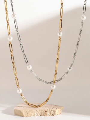 Two-tone pearl link necklace in gold and silver with alternating chain links and pearls.
