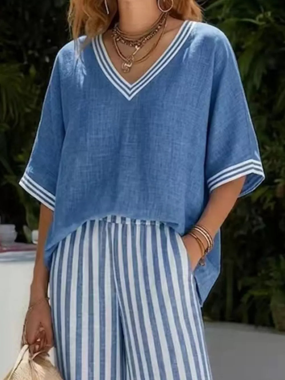 Blue striped V-neck top with white trim and matching wide-leg pants set