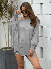 Light Gray knit sweater with boat neck, balloon sleeves, and scalloped pattern.