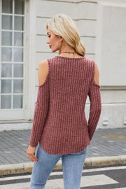 Ribbed cold-shoulder top in rust with long sleeves and ring detail.