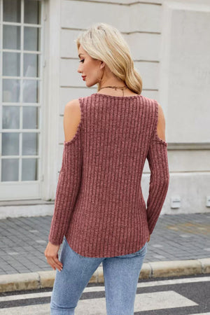 Ribbed cold-shoulder top in rust with long sleeves and ring detail.