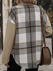 Panelled plaid shacket in tan with contrasting sleeves and patch pockets.