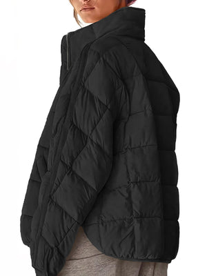 Black quilted bomber jacket with stand collar and diamond pattern.