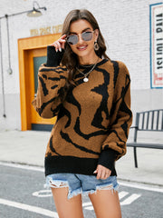Tiger stripe knit crewneck sweater in caramel with black accents, acrylic material.
