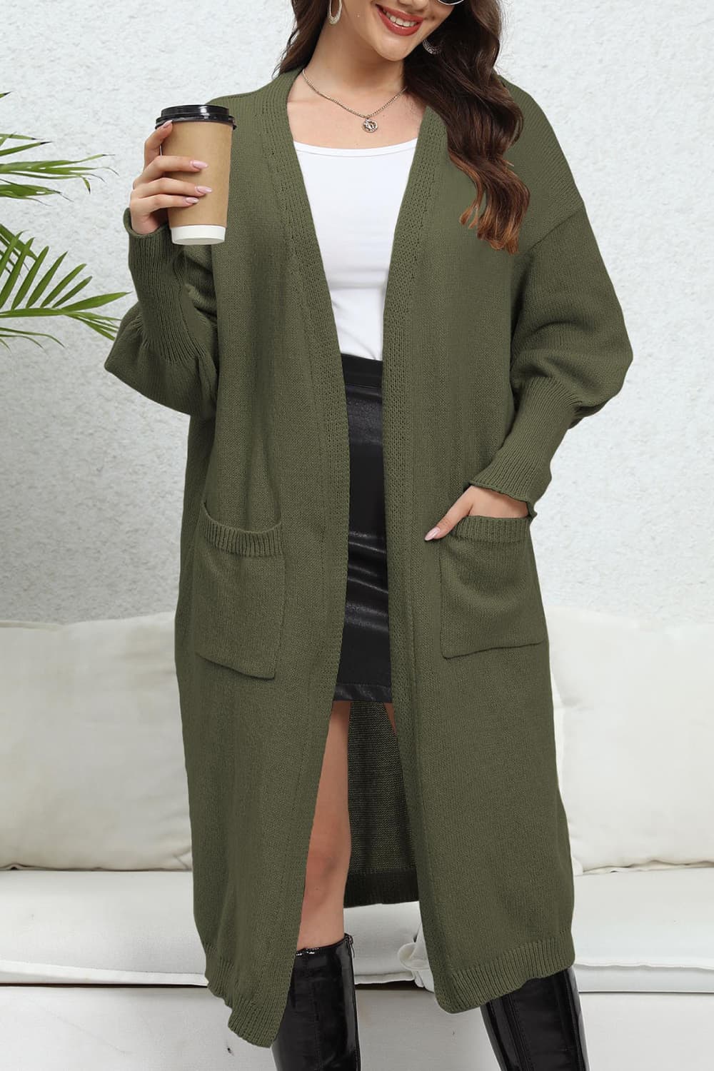Army green oversized pocketed knit cardigan with long sleeves and open front.