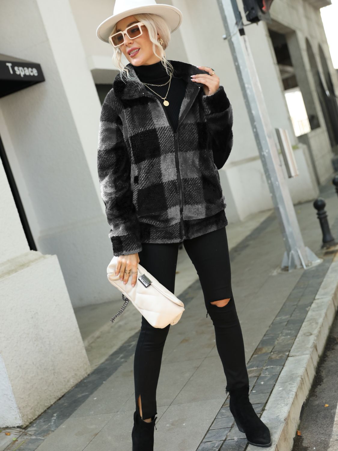 Charcoal plaid sherpa zip-up jacket with collared neckline and fuzzy texture.