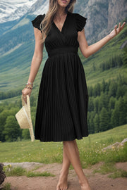 Black pleated dress with flutter sleeves and smocked waist, v-neckline.