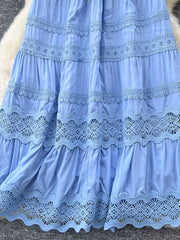 Blue tiered skirt with lace trim and drawstring detail.