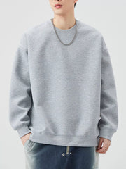 Oversized crew-neck sweatshirt in Melange Gray, with ribbed cuffs and hem.