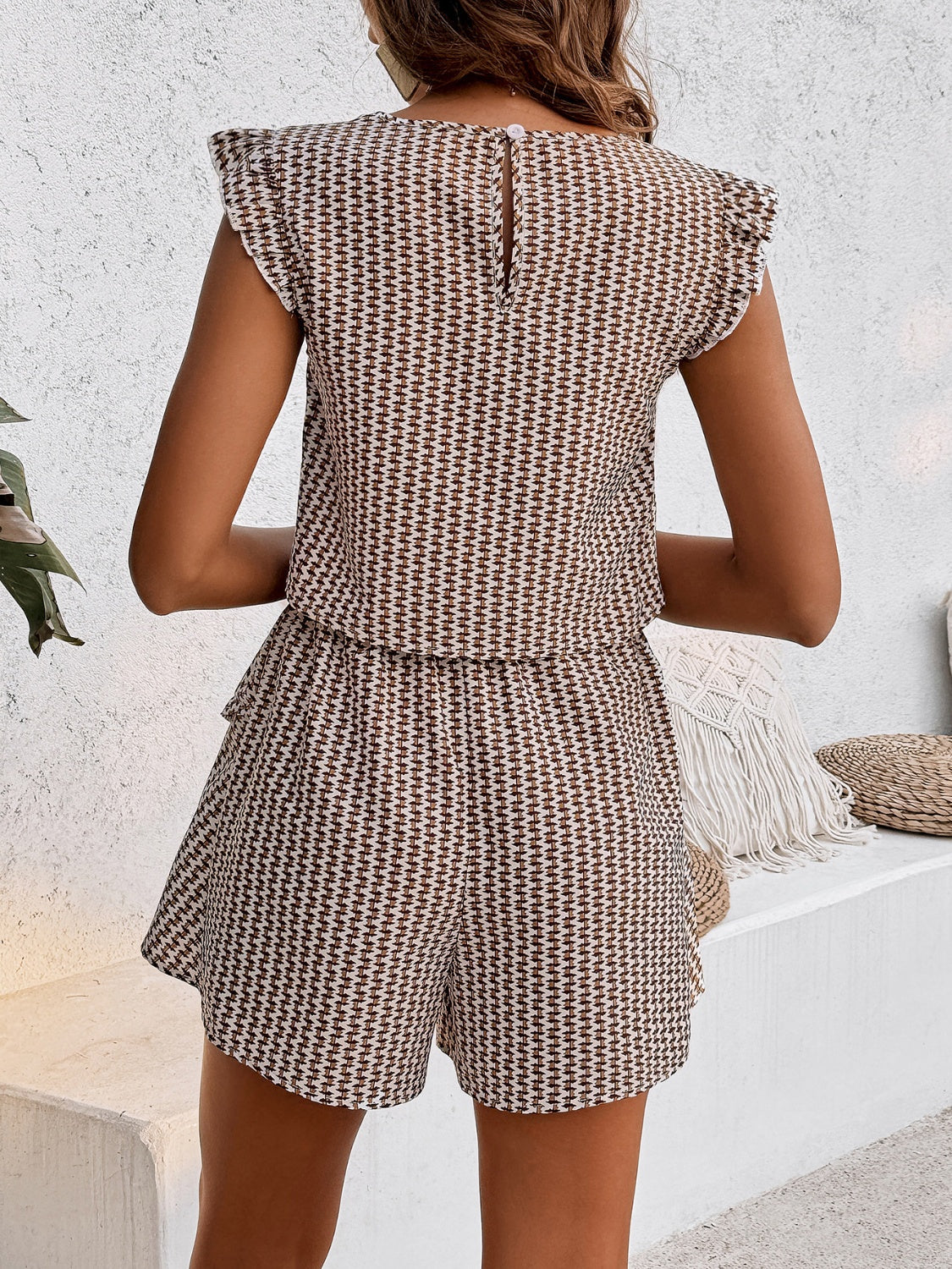 Textured ruffle sleeve co-ord set with shorts in a brown and white geometric pattern.