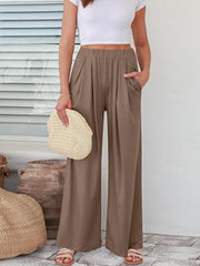 FlexiFit wide leg trousers in taupe with elastic waist and pockets, styled with a white crop top.
