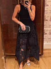 Black midi dress with crochet lace skirt and cutout detail.