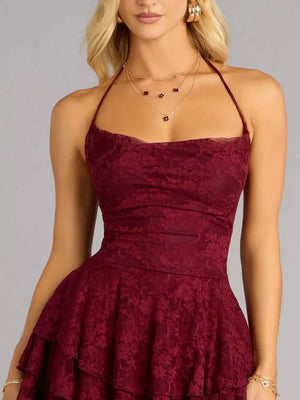 Burgundy lace halter neck mini dress with tiered ruffled skirt.
