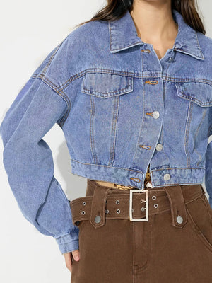Medium wash denim cropped jacket with balloon sleeves and buttoned front.