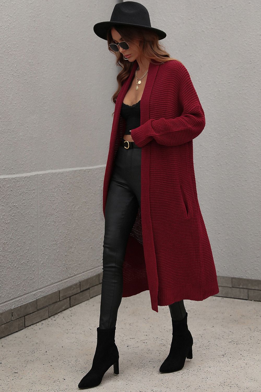 Textured knit maxi cardigan in wine with pockets, open front and long sleeves.