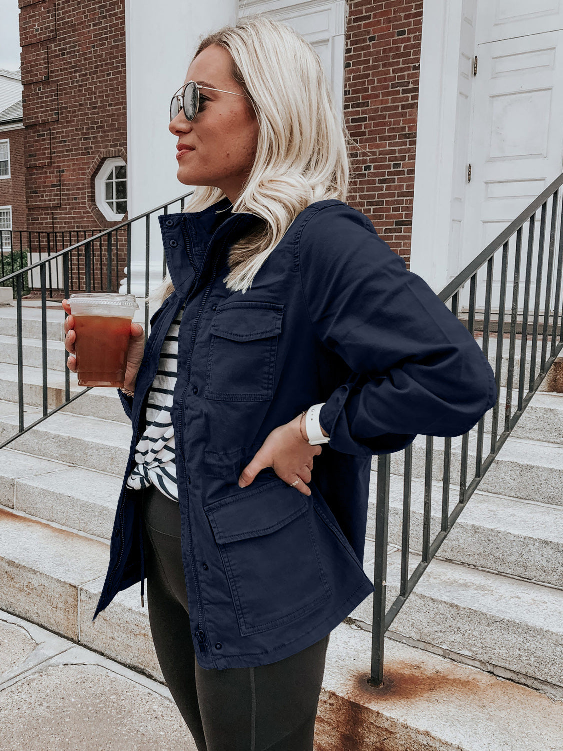 Dark Navy utility jacket with multiple pockets, a stand-up collar, and button closure.