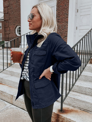 Dark Navy utility jacket with multiple pockets, a stand-up collar, and button closure.