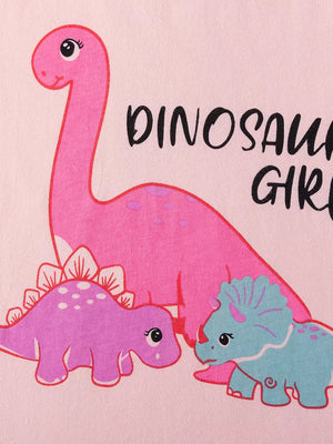 Children's pink graphic tee with playful dinosaurs and text.