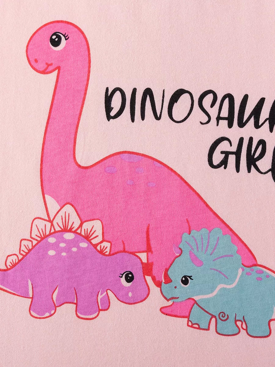 Children's pink graphic tee with playful dinosaurs and text.