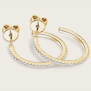 Gold C-hoop earrings with pavé-set cubic zirconia detail and post backs.