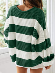 Striped oversized knit sweater in dark green and white with a crew neck.