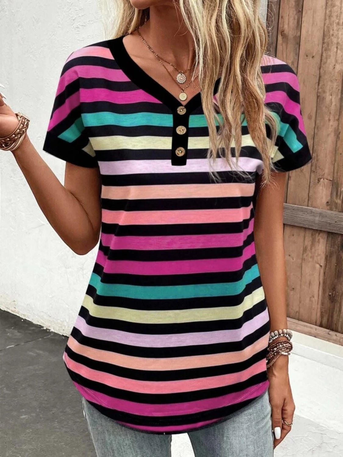 Rainbow stripe henley tee with button detail and short sleeves.