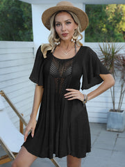 Black crochet inset beach cover-up dress with flutter sleeves and A-line cut.