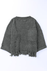Distressed dark gray knit sweater with crew neck, chest pocket, and frayed hem.