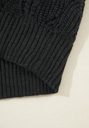 Black openwork knit V-neck pullover sweater with ribbed hem and detail.
