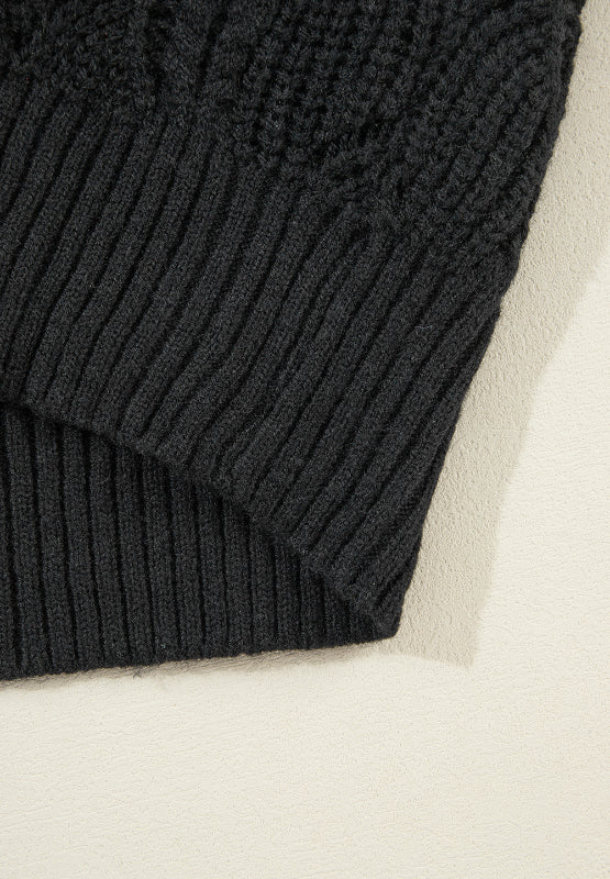 Black openwork knit V-neck pullover sweater with ribbed hem and detail.