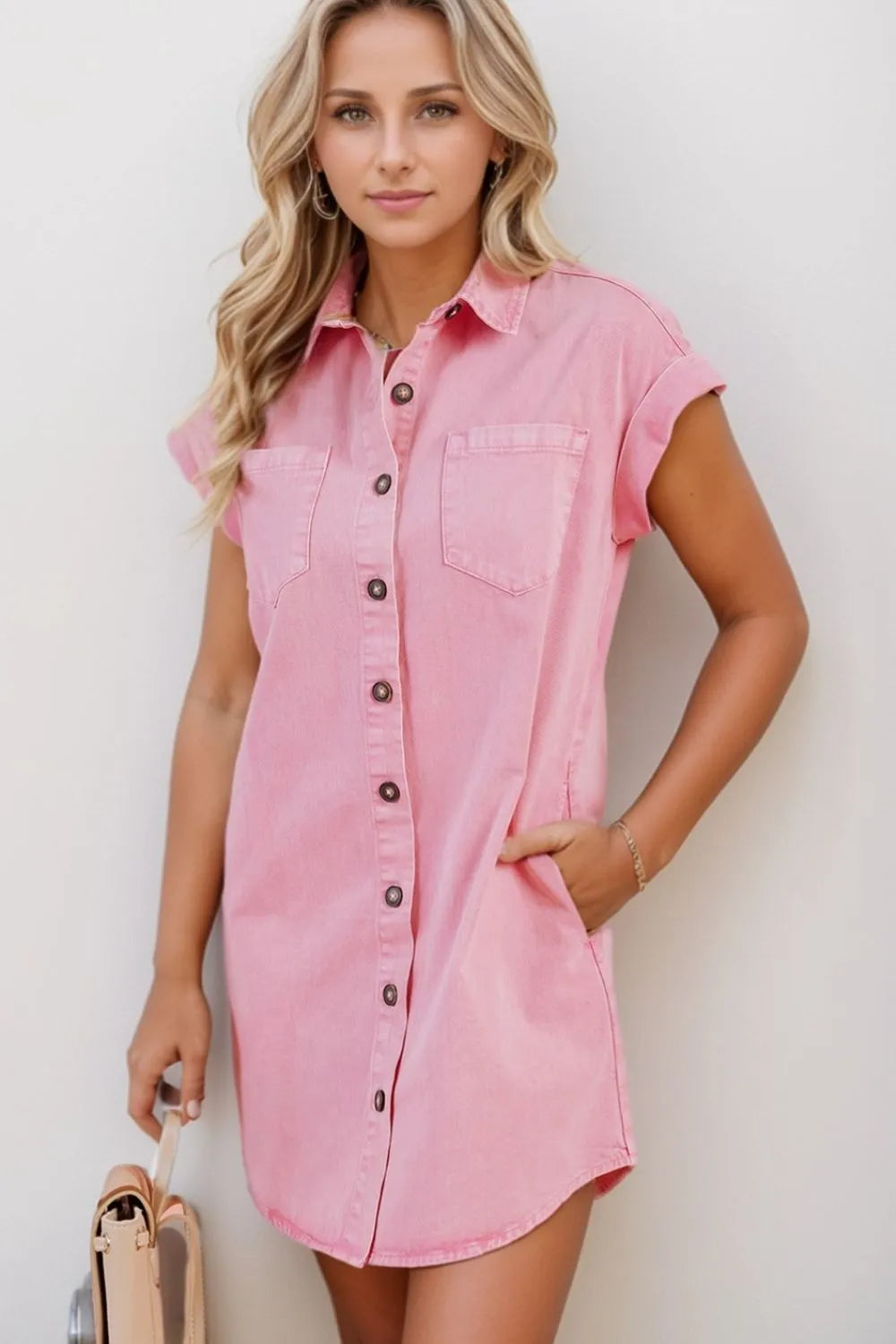 Rolled sleeve denim shirtdress in blush pink with button front and chest pockets.