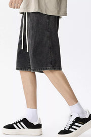 Black gray denim shorts for men with drawstring waist and vintage wash detail.