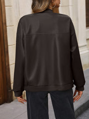 Brown zip up bomber jacket with ribbed cuffs and hem, featuring a horizontal seam detail on the back.