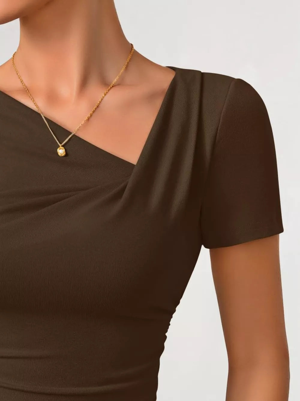 Brown asymmetrical maternity t-shirt with ruched neckline and short sleeves.