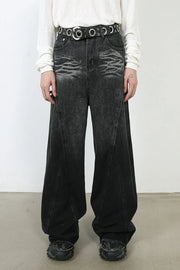 Sculpted dark denim palazzo trousers with a wide leg and distressed detailing.