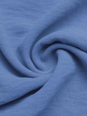 Blue textured fabric detail of maternity romper