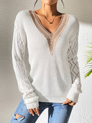 White openwork knit sweater with lace-trimmed V-neck and diamond pattern sleeves.
