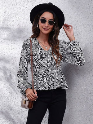 Gingham peplum blouse with gathered waist in leopard print, V-neck, long sleeves.