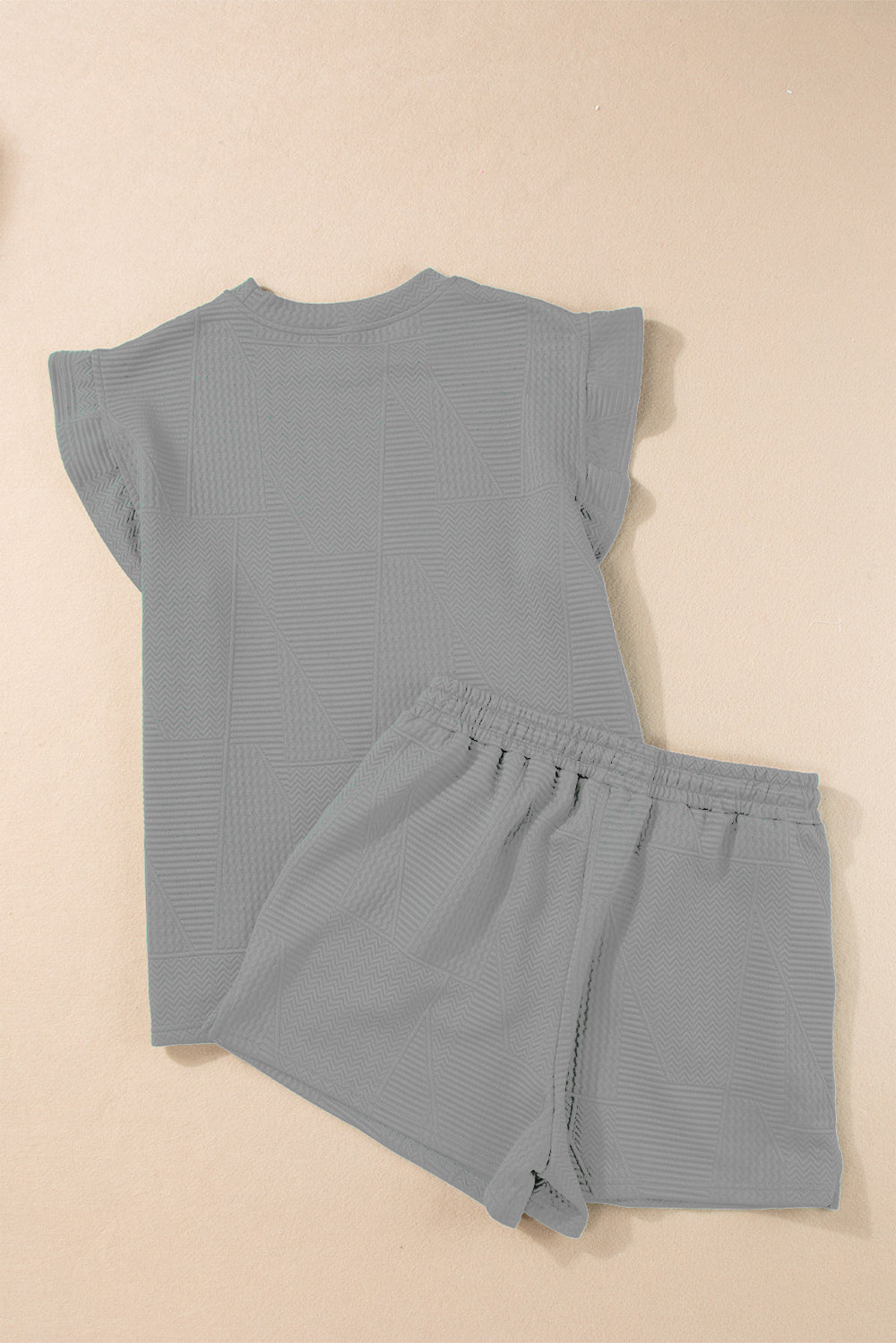 Gray textured loungewear set with flutter sleeve top and elastic waist shorts.