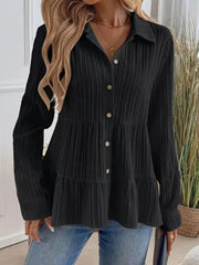 Black textured tiered button-down shirt with crinkled fabric and button details.