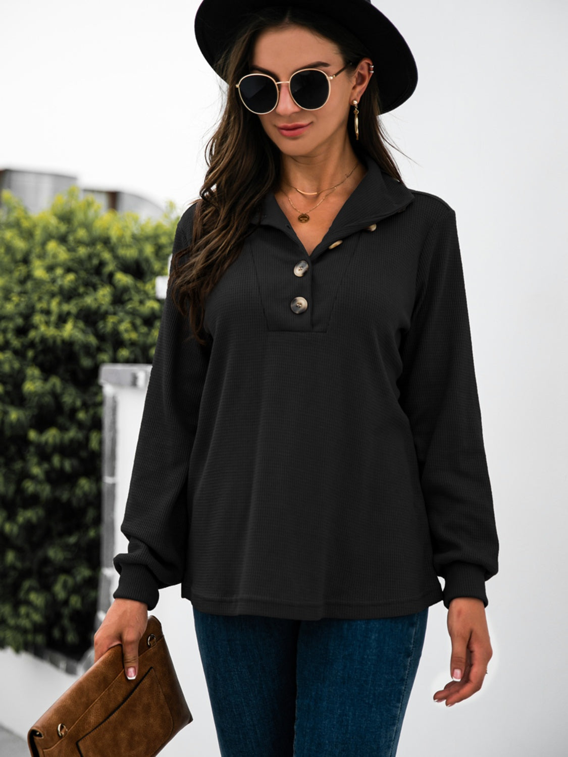 Black long sleeve waffle knit tee with button collar and cuff detail