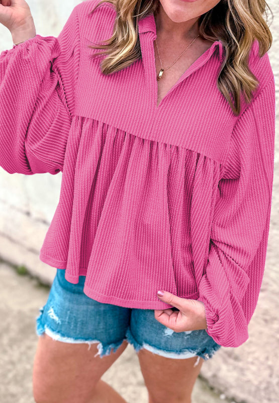 Hot pink textured blouse with gathered yoke, collar, and balloon sleeves.
