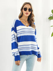 Acrylic V-neck sweater with wide blue and white stripes, long sleeves, and a relaxed fit.